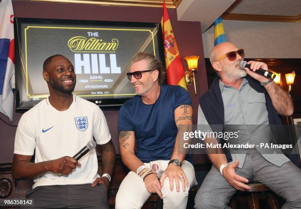 Ledley King, Robbie Savage and Keith Allen at the Lord Raglan Pub in London as fans watch the World Cup match between England and Belgium. PRESS...