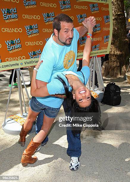 Singer/actor Joey Fatone dips television personality Melissa Rycroft at Smile Train's World Smile Search in Madison Square Park on April 23, 2010 in...