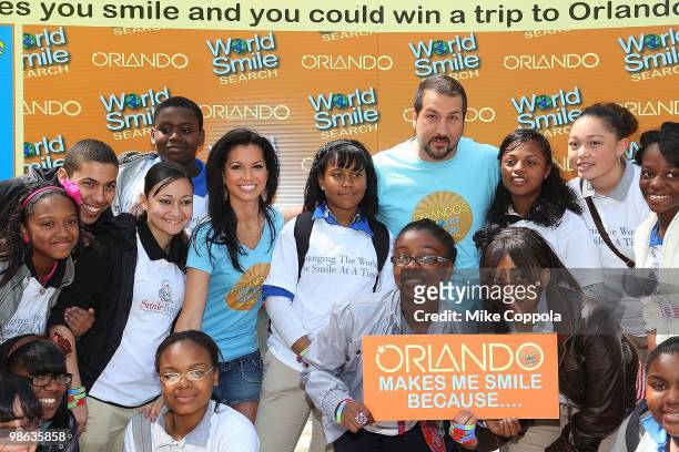 Television personality Melissa Rycroft and singer/actor Joey Fatone pose for pictures with kids at Smile Train's World Smile Search in Madison Square...