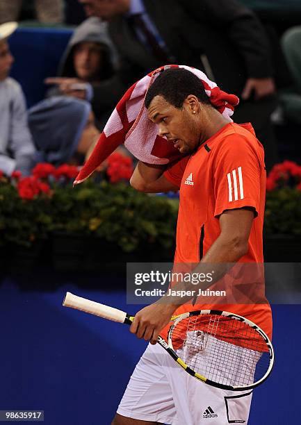 Jo-Wilfried Tsonga of France dries his head in his match against Thiemo de Bakker of The Netherlands during the quarter final match on day five of...