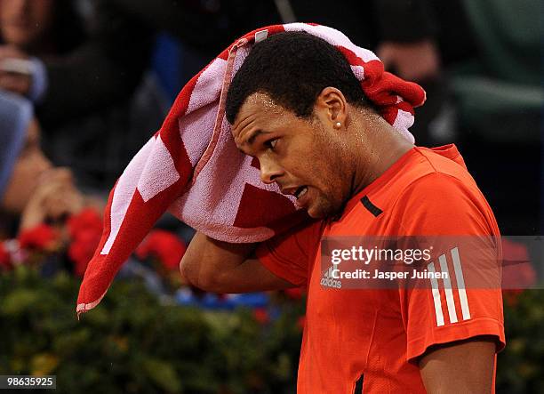 Jo-Wilfried Tsonga of France dries his head in his match against Thiemo de Bakker of The Netherlands during the quarter final match on day five of...