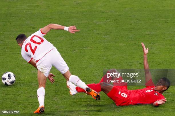 Tunisia's midfielder Ghailene Chaalali fights for the ball with Panama's midfielder Edgar Barcenas during the Russia 2018 World Cup Group G football...