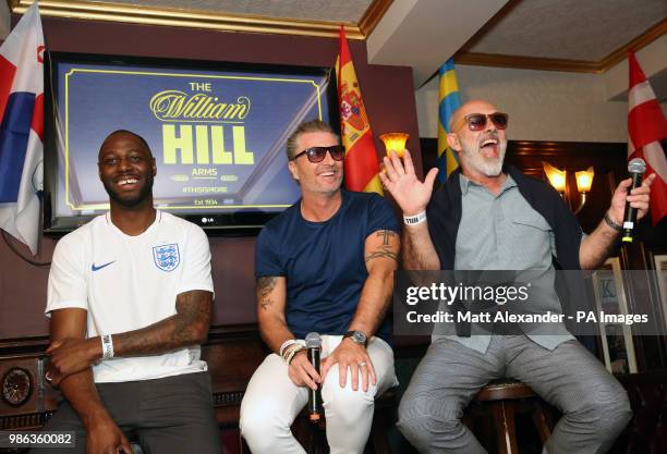 Ledley King, Robbie Savage and Keith Allen at the Lord Raglan Pub in London as fans watch the World Cup match between England and Belgium.