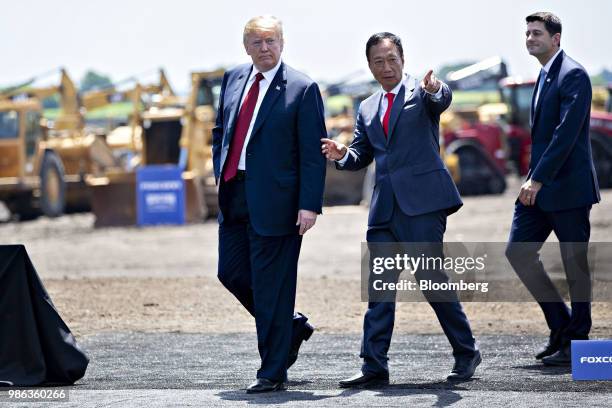 President Donald Trump, left, speaks with Terry Gou, chairman of Foxconn Technology Group, after the groundbreaking ceremony for the Foxconn facility...