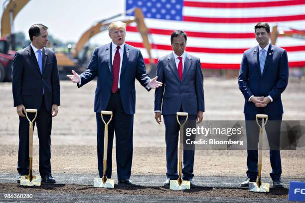 President Donald Trump, second left, speaks as Scott Walker, governor of Wisconsin, from left, Terry Gou, chairman of Foxconn Technology Group, and...