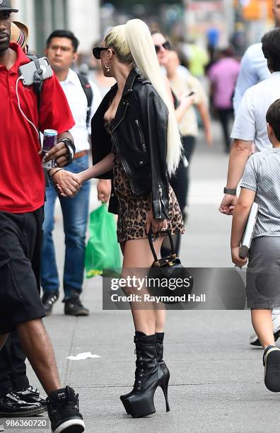 Singer Lady Gaga and Christian Carino are seen walking in SoHo on June 28, 2018 in New York City.