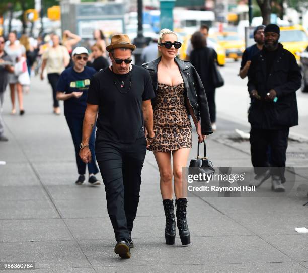 Singer Lady Gaga and Christian Carino are seen walking in SoHo on June 28, 2018 in New York City.