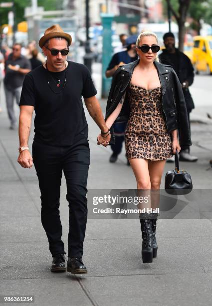 Singer Lady Gaga and Christian Carino are seen walking in SoHo on June 28, 2018 in New York City.