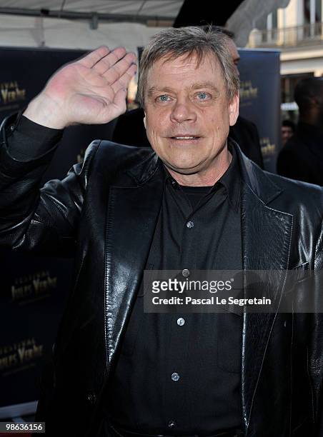 Actor Mark Hamill waves as he attends a Tribute to Star Wars V during the 18th Adventure Film Festival at Le Grand Rex on April 23, 2010 in Paris,...