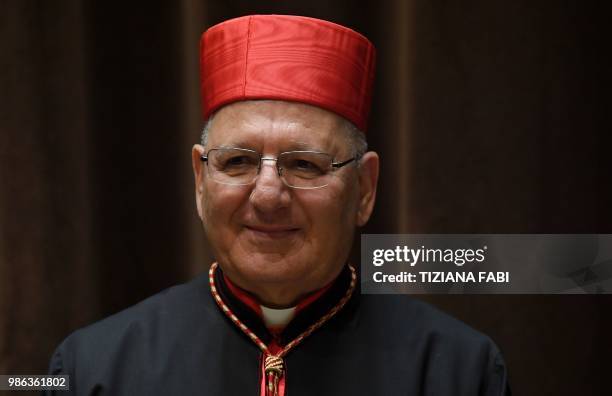 New Cardinal Louis Raphael I Sako of Iraq poses as he attends the courtesy visit of relatives following a consistory for the creation of new...