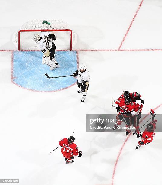 Daniel Alfredsson, Mike Fisher, Jason Spezza and Erik Karlsson of the Ottawa Senators celebrates a goal against Maxime Talbot and Marc-Andre Fleury...