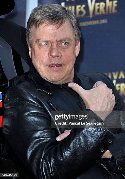 Actor Mark Hamill poses with Darth Vader as he attends a Tribute to Star Wars V during the 18th Adventure Film Festival at Le Grand Rex on April 23,...