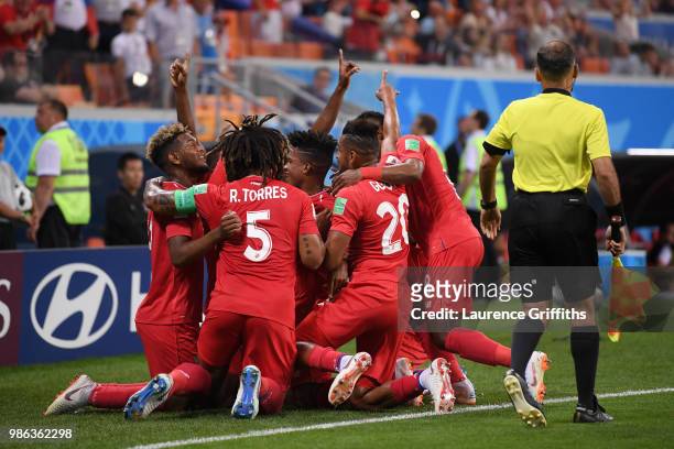 Jose Luis Rodriguez of Panama celebrates with teammates his team's first goal, an own goal by Yassine Meriah of Tunisia, during the 2018 FIFA World...