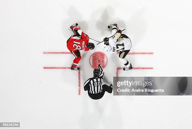 Thor Nelson drops the puck as Jesse Winchester of the Ottawa Senators faces off against Mike Rupp the Pittsburgh Penguins in Game Four of the Eastern...