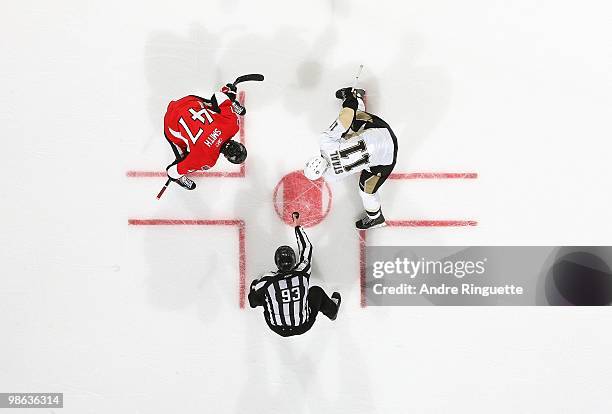 Brian Murphy drops the puck as Zack Smith of the Ottawa Senators faces off against Jordan Staal of the Pittsburgh Penguins in Game Four of the...