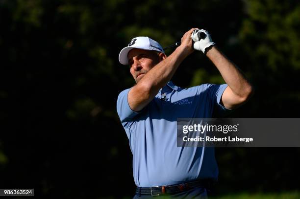Hall of Fame pitcher John Smoltz makes a tee shot on the 12th hole during round one of the U.S. Senior Open Championship at The Broadmoor Golf Club...