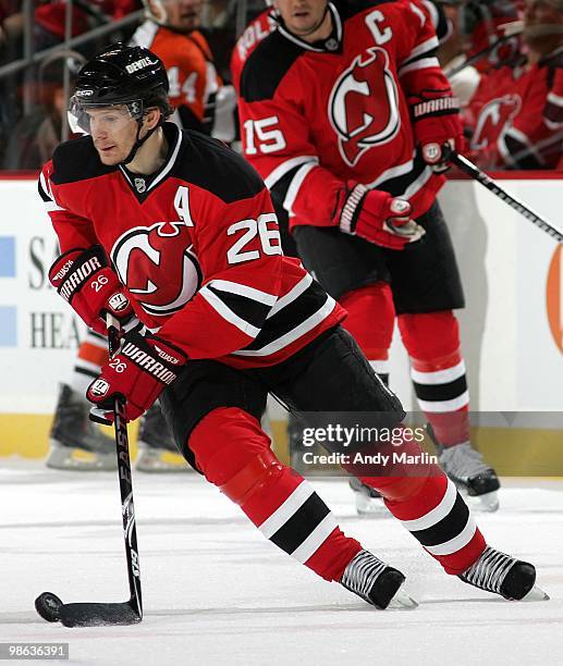 Patrik Elias of the New Jersey Devils plays the puck against the Philadelphia Flyers in Game Five of the Eastern Conference Quarterfinals during the...