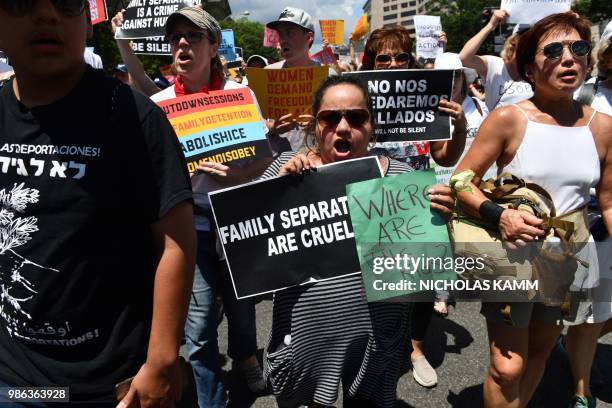 People demonstrate in Washington, DC, on June 28 demanding an end to the separation of migrant children from their parents. - US President Donald...