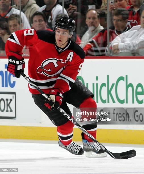 Zach Parise of the New Jersey Devils plays the puck against the Philadelphia Flyers in Game Five of the Eastern Conference Quarterfinals during the...