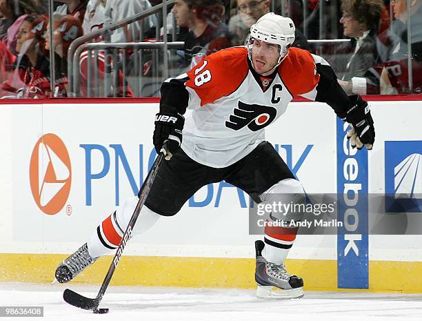 Mike Richards of the Philadelphia Flyers plays the puck against the New Jersey Devils in Game Five of the Eastern Conference Quarterfinals during the...