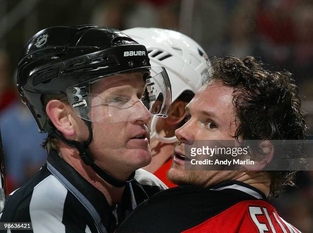 Patrik Elias of the New Jersey Devils is held back by linesman Jean Morin against the Philadelphia Flyers in Game Five of the Eastern Conference...