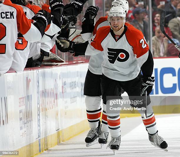 Claude Giroux of the Philadelphia Flyers is congratulated by his teammates after scoring his second goal of the game against the New Jersey Devils in...