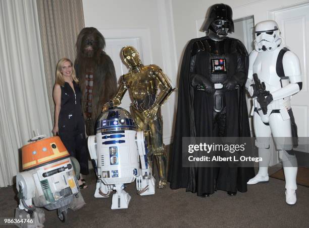 Actress Rhea Seehorn posea with Chewbacca, C3PO, Darth Vader, Storm Trooper, Chopper and R2D2 at the After Party at the Academy Of Science Fiction,...