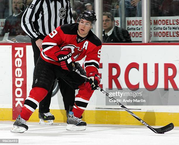 Zach Parise of the New Jersey Devils plays the puck against the Philadelphia Flyers in Game Five of the Eastern Conference Quarterfinals during the...