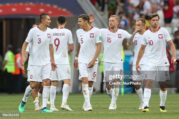 The Poland's players Artur Jedrzejczyk, Robert Lewandowski, Jan Bednarek, Kamil Glik , Kamil Grosicki, and Grzegorz Krychowiak celebrate the victory...