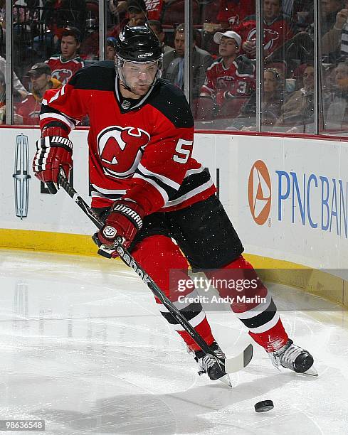 Colin White of the New Jersey Devils plays the puck against the Philadelphia Flyers in Game Five of the Eastern Conference Quarterfinals during the...