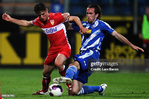 Christian Traesch of Stuttgart is challenged by Christian Fuchs of Bochum during the Bundesliga match between VfL Bochum and VfB Stuttgart at...