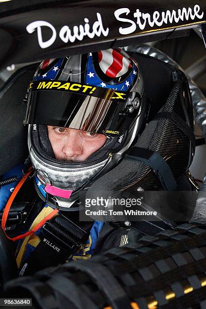 David Stremme, driver of the Air National Guard Ford, sits in his car during practice for the NASCAR Sprint Cup Series Aaron's 499 at Talladega...