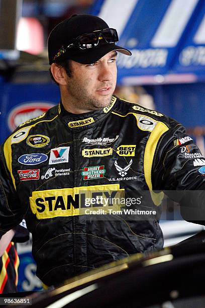Elliott Sadler, driver of the Stanley/Bostitch Ford, stands in the garage during practice for the NASCAR Sprint Cup Series Aaron's 499 at Talladega...