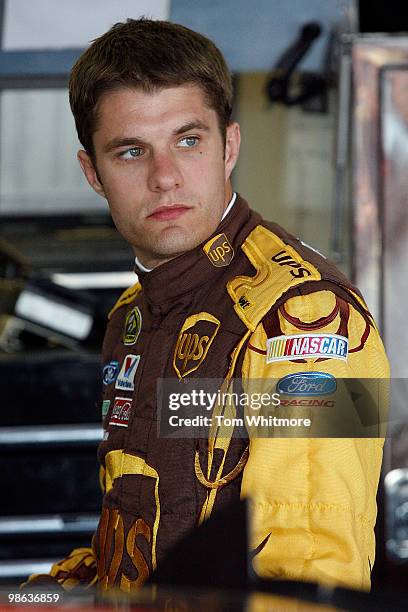 David Ragan, driver of the UPS Ford, stands in the garage during practice for the NASCAR Sprint Cup Series Aaron's 499 at Talladega Superspeedway on...