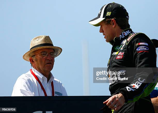 Carl Edwards , driver of the Aflac Ford, talks with car owner Jack Roush during practice for the NASCAR Sprint Cup Series Aaron's 499 at Talladega...
