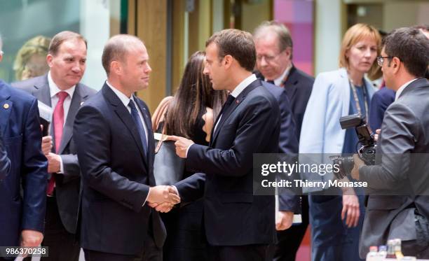 Swedish Prime Minister Kjell Stefan Lofven is looking at the Maltese Prime Minister Joseph Muscat and the French President Emmanuel Macron during an...