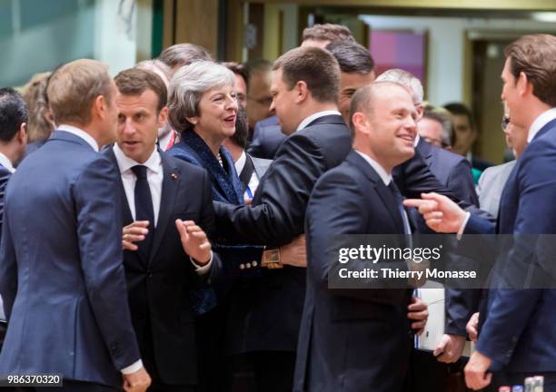 President of the European Council Donald Franciszek Tusk is talking with the French President Emmanuel Macron, the Prime Minister of the United...