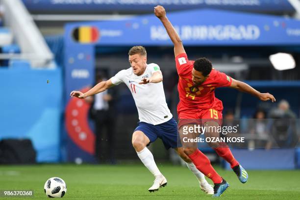 England's forward Jamie Vardy vies with Belgium's midfielder Moussa Dembele during the Russia 2018 World Cup Group G football match between England...