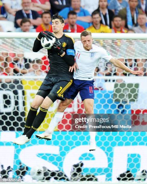 Thibaut Courtois of Belgium competes with Jamie Vardy of England during the 2018 FIFA World Cup Russia group G match between England and Belgium at...