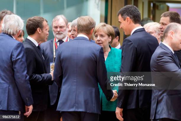 President of the European Commission Jean-Claude Juncker is talking with the French President Emmanuel Macron, the Prime Minister of the United...