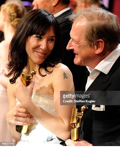 Sibel Kekili and Burghart Klaussner receive their Lolas during the 60th German Film Prize awards Gala at Friedrichstadtpalast on April 23, 2010 in...