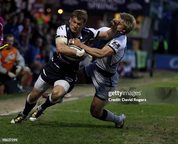 Mark Cueto of Sale is tackled by Charlie Amesbury during the Guinness Premiership match between Sale Sharks and Newcastle Falcons at Edgeley Park on...