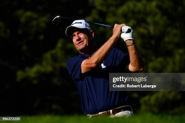 Bob Ford makes a tee shot on the 12th hole during round one of the U.S. Senior Open Championship at The Broadmoor Golf Club on June 28, 2018 in...