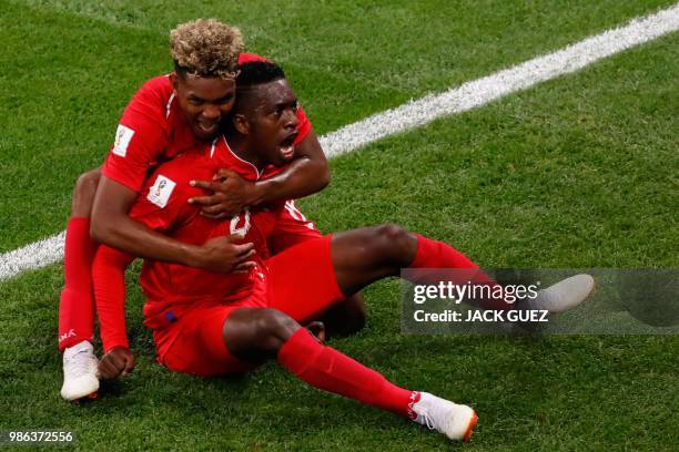 Panama's midfielder Jose Luis Rodriguez celebrates with teammate Panama's midfielder Ricardo Avila after scoring during the Russia 2018 World Cup...