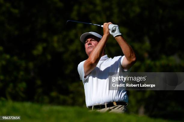 Paul Goydos makes a tee shot on the 12th hole during round one of the U.S. Senior Open Championship at The Broadmoor Golf Club on June 28, 2018 in...