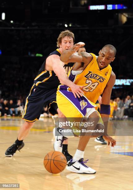 Kobe Bryant of the Los Angeles Lakers drives to the basket against Troy Murphy of the Indians Pacers at Staples Center on March 2, 2010 in Los...