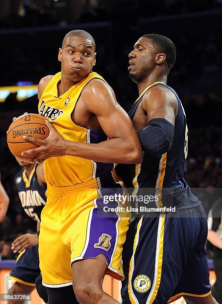 Andrew Bynum of the Los Angeles Lakers drives to the basket against Roy Hibbert of the Indians Pacers at Staples Center on March 2, 2010 in Los...