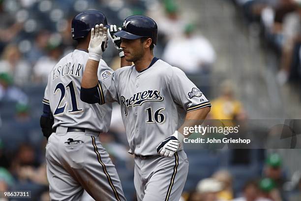 George Kottaras of the Milwaukee Brewers is congratulated on his homerun during the game between the Milwaukee Brewers and the Pittsburgh Pirates on...