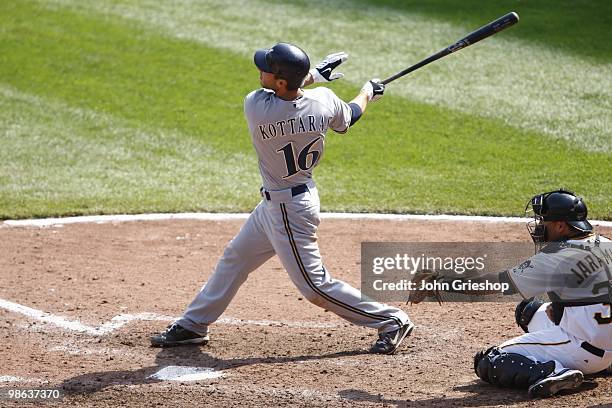 George Kottaras of the Milwaukee Brewers hits a RBI sacrifice fly during the game between the Milwaukee Brewers and the Pittsburgh Pirates on...
