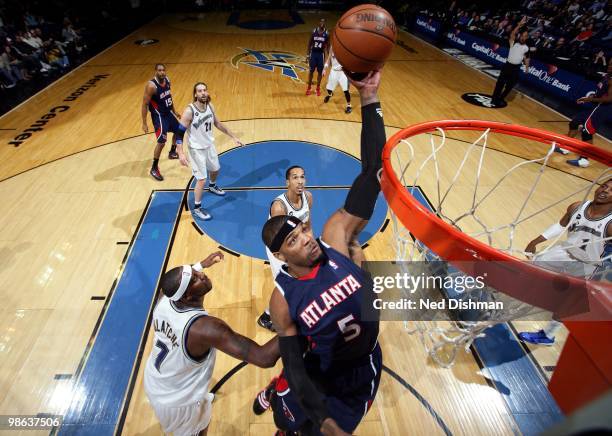 Josh Smith of the Atlanta Hawks goes up for a shot against Andray Blatche of the Washington Wizards during the game at the Verizon Center on April...